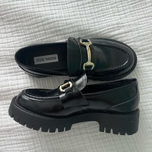 Steve Madden Glossy Black Loafers with Gold Accent
